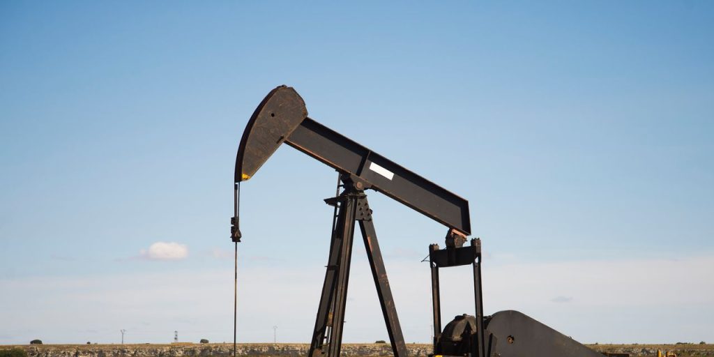 Oil prices settle at highest since late April, buoyed by a weaker dollar and supply cuts