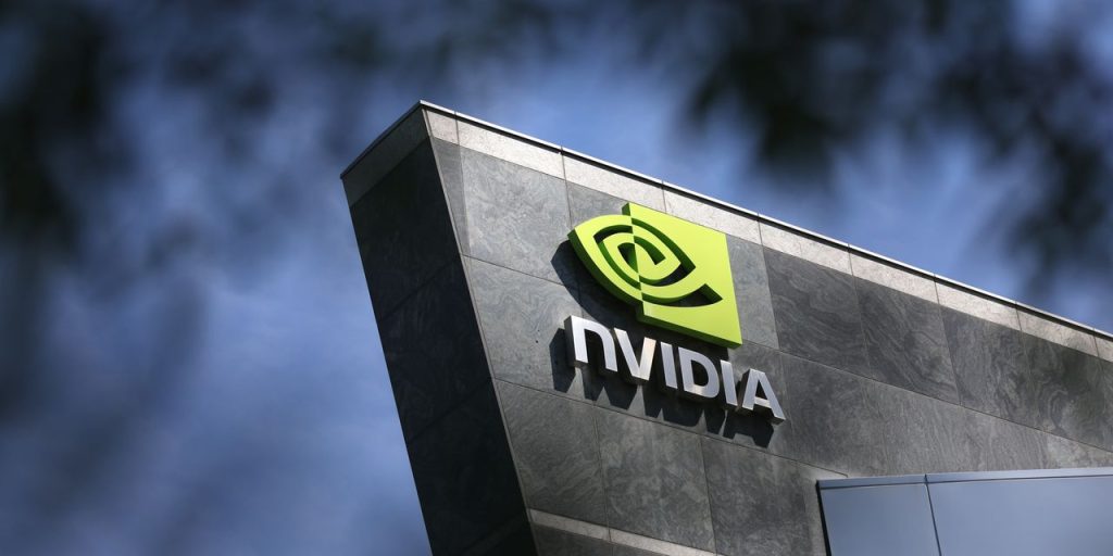 Dow down 100 points, Nasdaq edges higher after Powell reiterates Fed could raise rates twice more