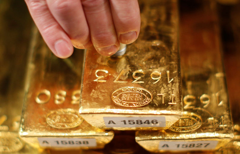 Gold sinks as dollar surges on strong payrolls data