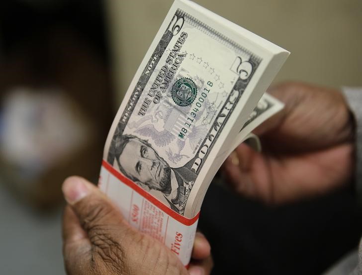 Dollar holds steady, yuan rises on better-than-expected China data