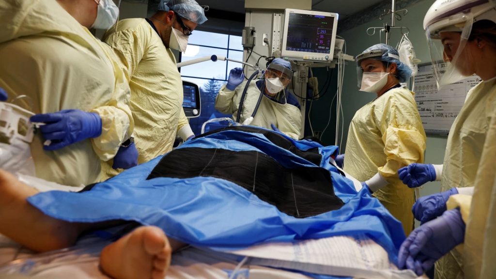 Covid hospitalizations spike with new variant as school returns, U.S. readies vaccines