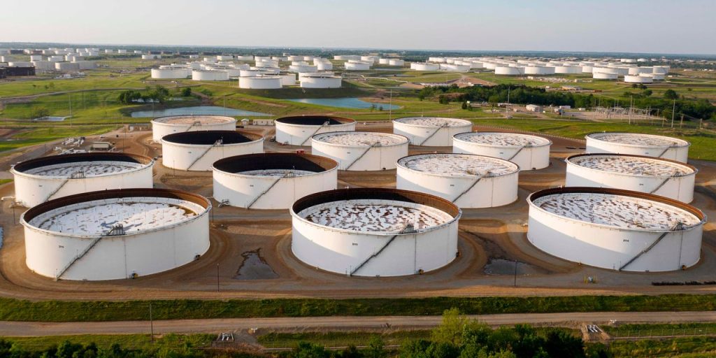 Oil prices settle at a 5-week low as U.S. gasoline supplies post a sharp weekly climb