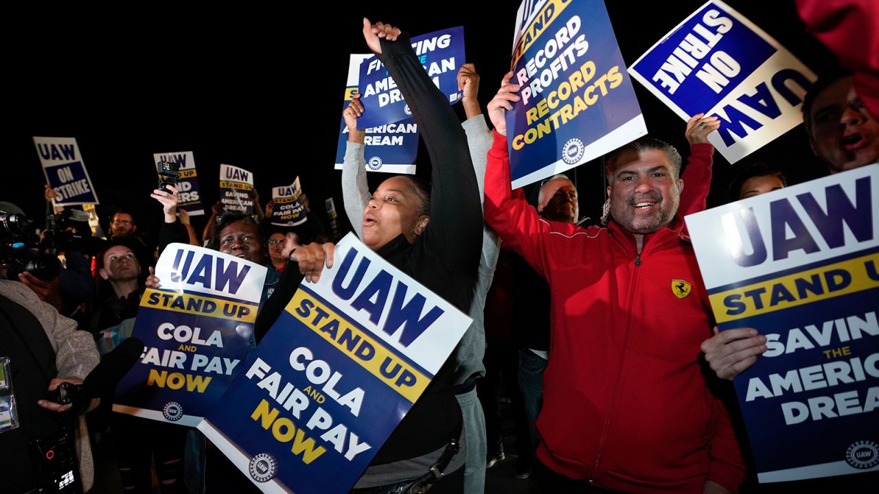 Striking United Auto Workers picket at Ford's Michigan Assembly Plant in Wayne, Mich., shortly after midnight Friday, Sept. 15, 2023.