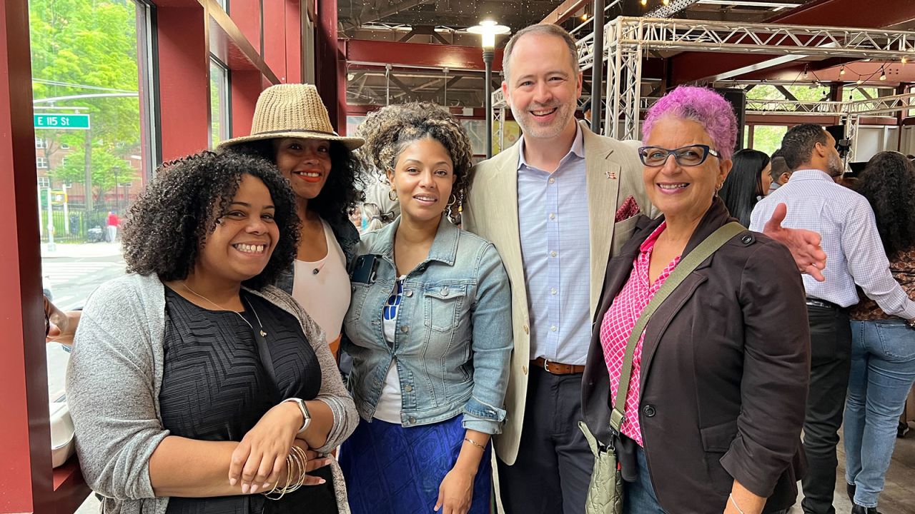 Xavier Santiago (center), board chair of Community Board 11.