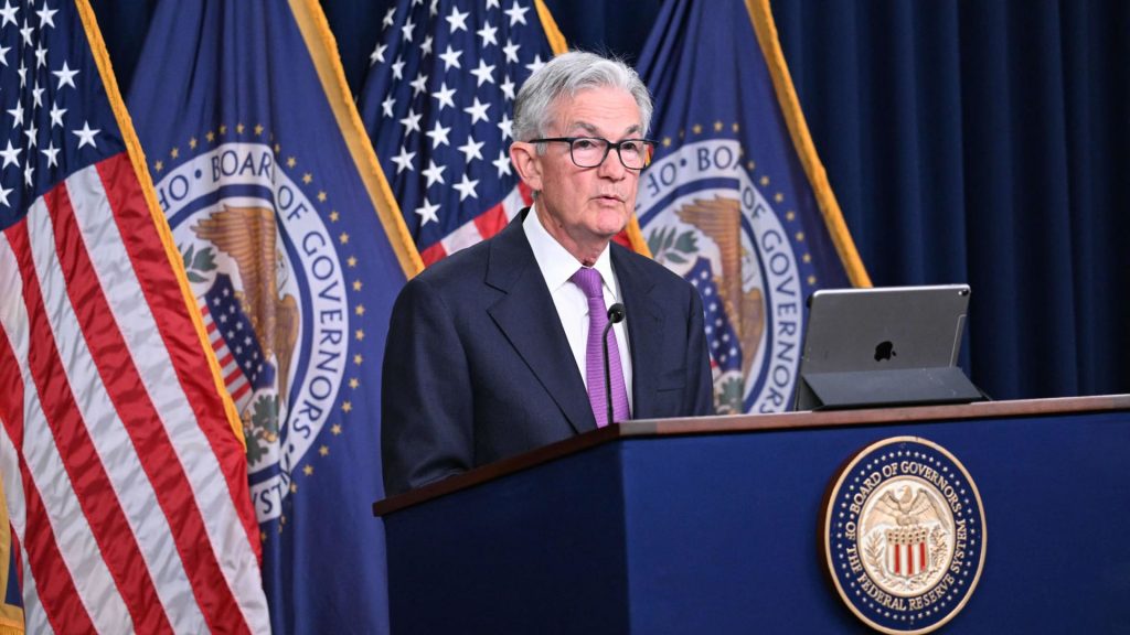 Fed holds rates steady, upgrades assessment of economic growth