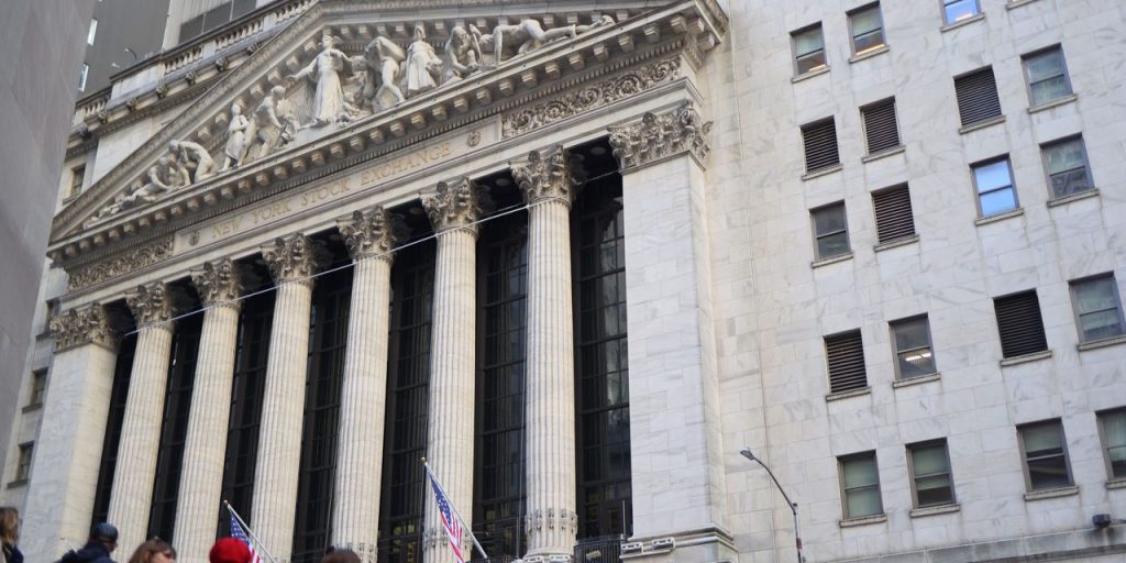 Dow jumps over 300 points as Nasdaq leads stocks toward weekly gains