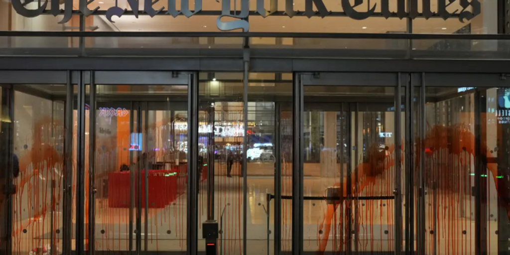 Anti-Israel protesters swarm Grand Central Terminal, splatter fake blood on New York Times building and set Israel flag ablaze